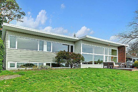 Paul Thiry, the father of Northwest modernism and chief architect of the Seattle Center and Frye Art Museum designed a handful of special homes in Seattle. Located in West Seattle, Thiry's Marine View Drive home is a wonderfully sited modern masterpiece fit for the pages of your favorite modern magazine. Situated on a large parcel with unobstructed territorial views of Puget Sound and Mt. Rainier, this unique home has been in the hands of modern lovers who added significant updates both outdoors and in, while maintaining mid-century details as conceived by Thiry in 1947.