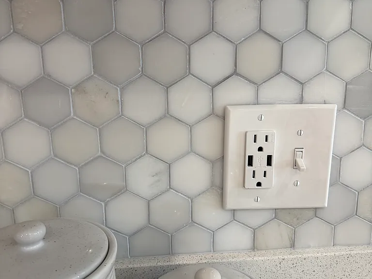 Hexagon backsplash and USB outlets in every kitchen