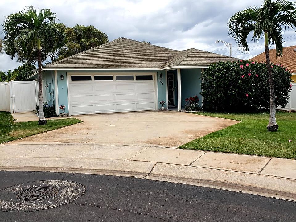 Two car garage with added parking in the driveway