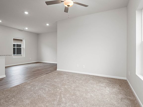 The open layout has the family room open to the kitchen and dining area.