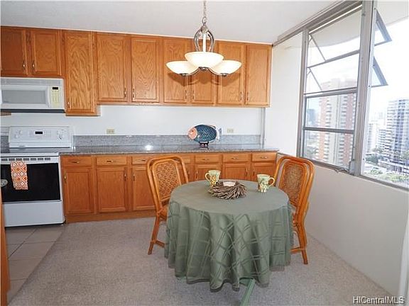 The dining area is located off the kitchen and features casement windows for great air flow and spectacular views.