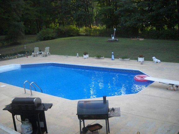 Pool in fenced in back yard