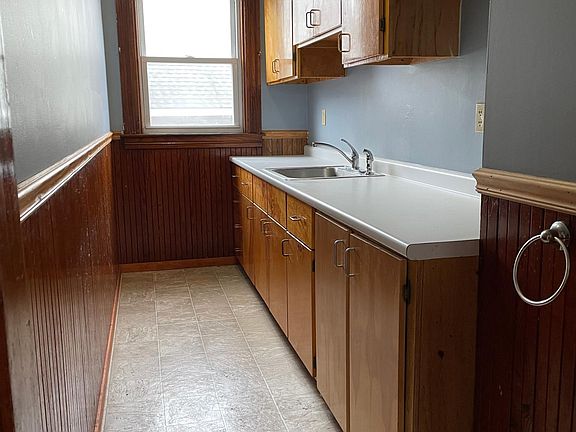 Kitchen sink and storage (new dishwasher not pictured)