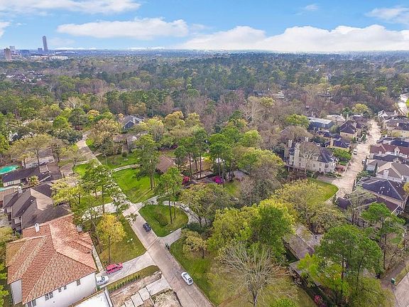 Aerial perspective shows the lush wooded neighborhood of Timber Lane Terrace subdivision.