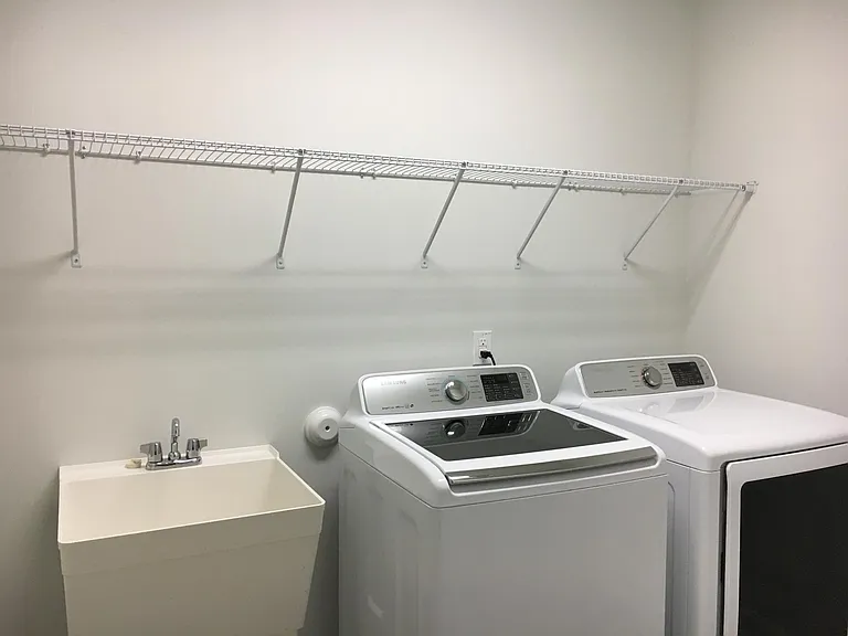 Laundry room with Samsung washer/ dryer (included) and sink