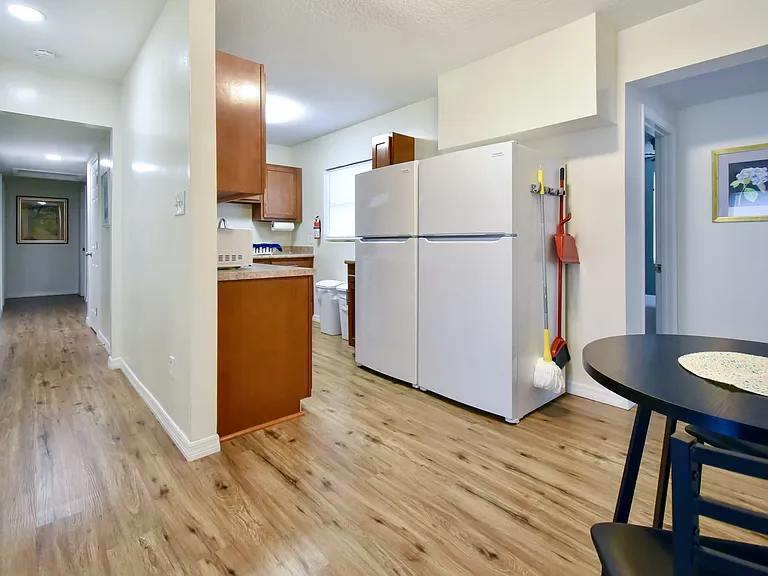 Dining area with kitchen and hallway
