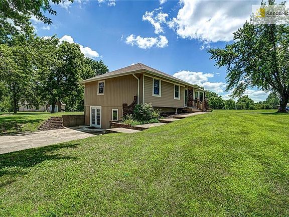 French doors lead to finished lower level. Two large recreation rooms, non conforming bathroom, full bath and laundry room with half bath.