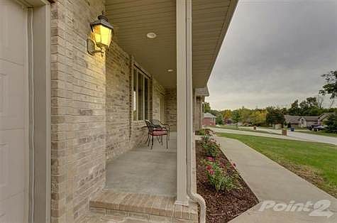 Covered front porch, ideal for enjoying the peace & quiet of the neighborhood.