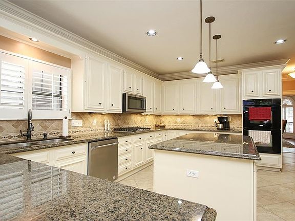 The Chef of the household will find everything they need in this deluxe kitchen including undermount lighting. Hall with butlers pantry leads to formal dining room.