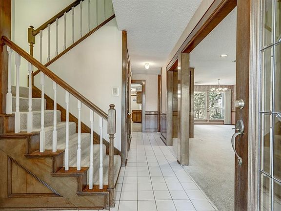 Wonderful sightlines into the living room and formal dining and into the courtyard, or straight ahead to the huge kitchen and br