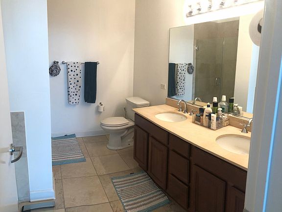 Double Sink Master Bathroom with Standing Shower and Soaker Tub.