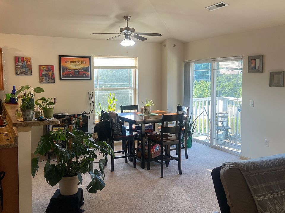 Open concept living - dining room with small private patio facing Siggelkow