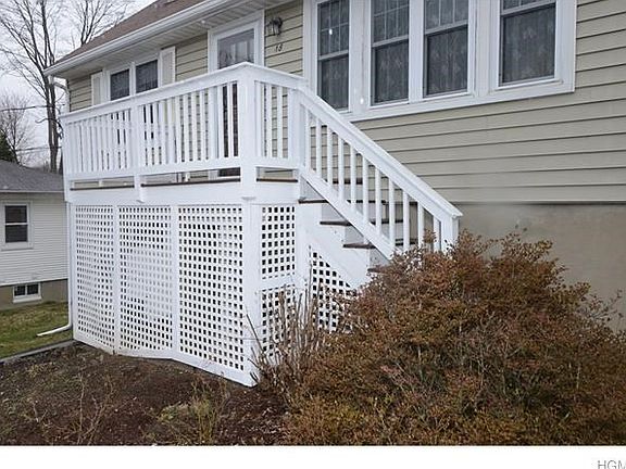Front steps to house. Colorful shrubbery in the Spring and Summer.