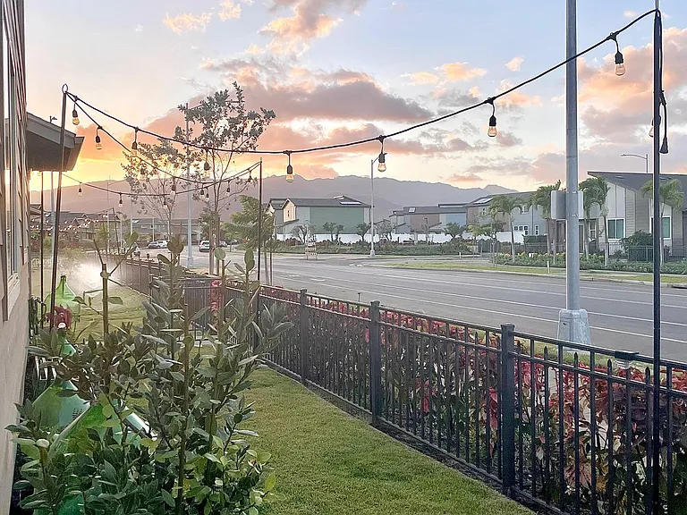 Backyard with small lanai during evening sunset.