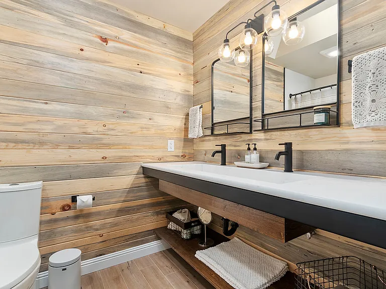 Guest bathroom with dual faucet and trough sink
