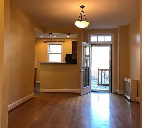 Dining room view from living room. Door leading to backyard.