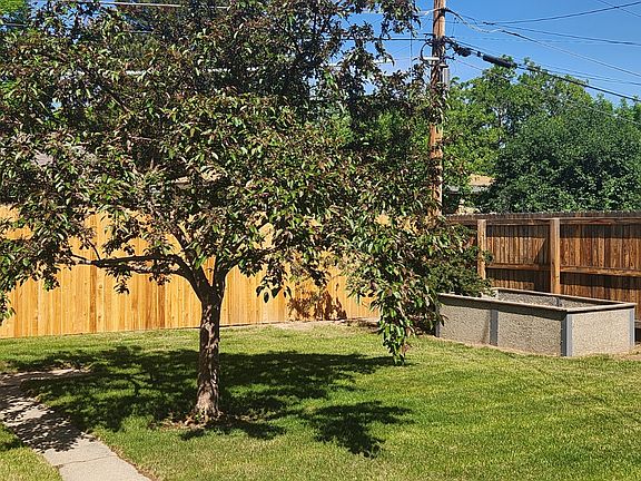 New 6 foot cedar fence and raised garden bed