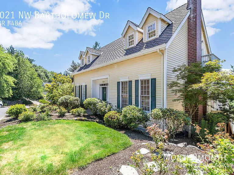 9021 NW Bartholomew Dr — Photo 38