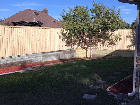 Newly fenced back yard