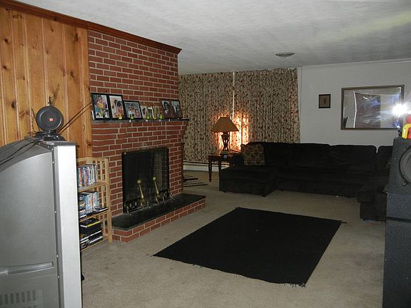 Spacious living room with fireplace.