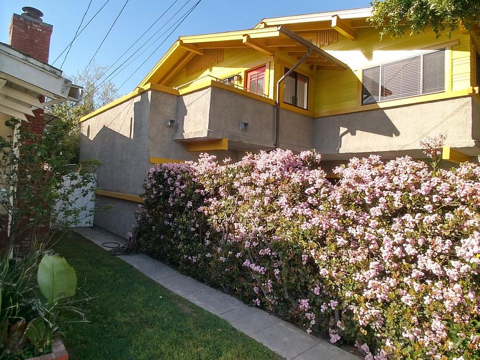 Standalone residence over garages.