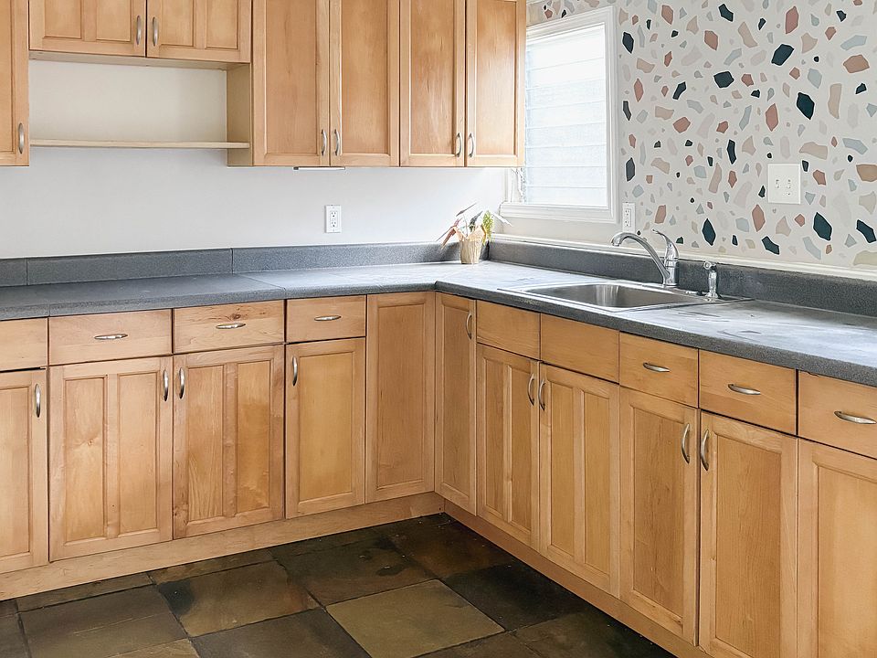 Kitchen: maple cabinets, slate floors