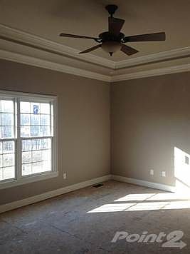 Master Bedroom has a beautiful view and includes lots of detailing with molding and tray ceiling.