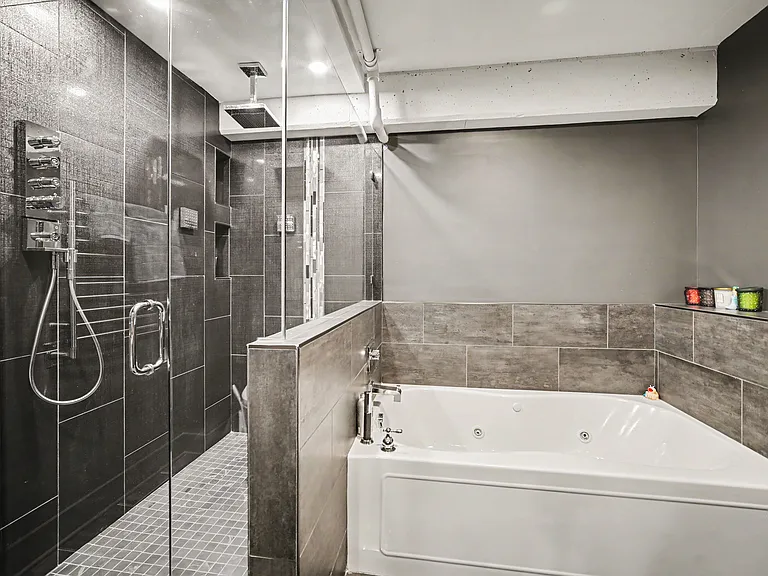 Master bathrooms features soak in bathtub with jets, massive shower with rain head and 2 additional wall shower heads and handheld shower head, backlit mirror, towel warmer, and bidet