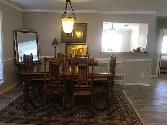 iPhone picture doesn't do the justice to this beautiful dining space. It gets a lot of natural lights. Note the kitchen overlooking the dining