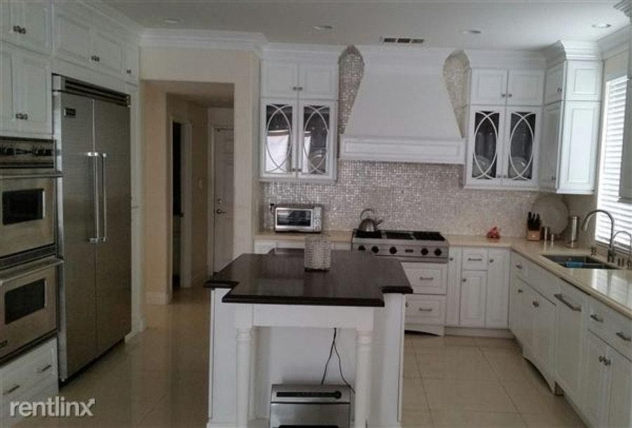 Remodeled Kitchen with Quartz Counters, Movable Island, Lit