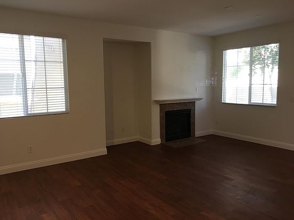 Living room with fireplace & media alcove