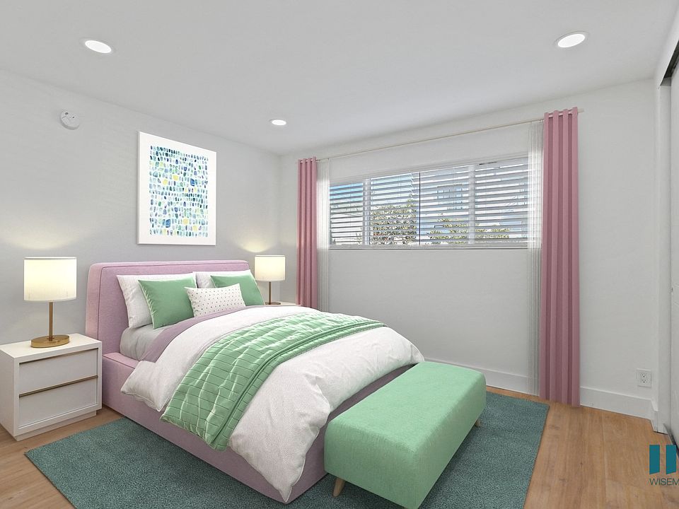 Bedroom with Mirrored Closet, Vinyl Flooring, and Large-Size Windows