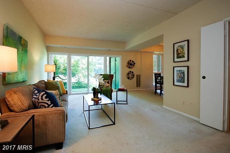 Family/living room with sliding door opens to patio