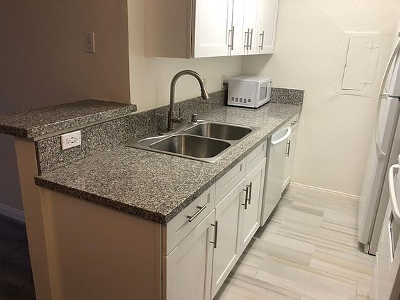 Kitchen with new cabinets featuring Samsung Digital Control Dishwasher