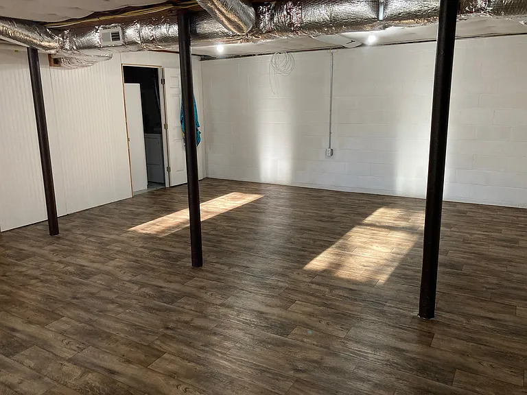 2nd view of heated bonus space, looking towards laundy room.