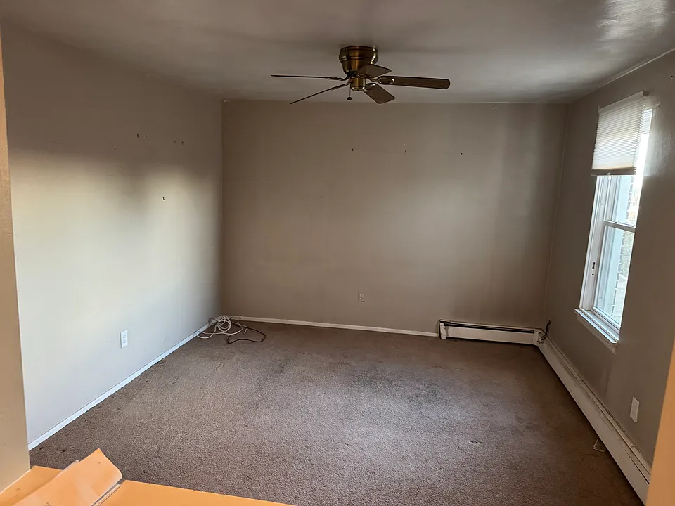 Large Living Room with deep closet and natural light.