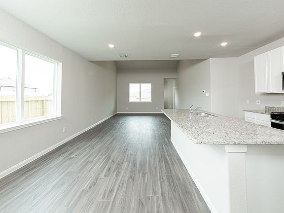 Kitchen and Dining Area to Family Room