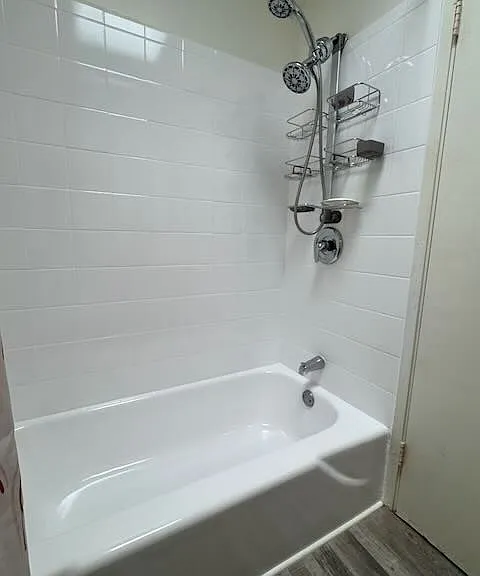 Full bath features shower over tub