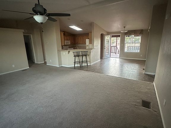Livingroom looking into dining room/ kitchen