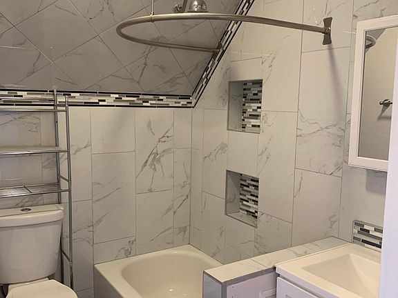 Upstairs Bathroom with Custom tile highlighting Bathroom design