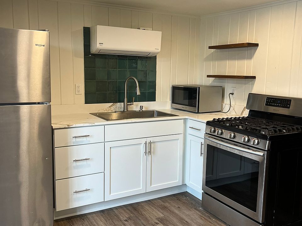 Microwave comes with apartment. Floating shelves