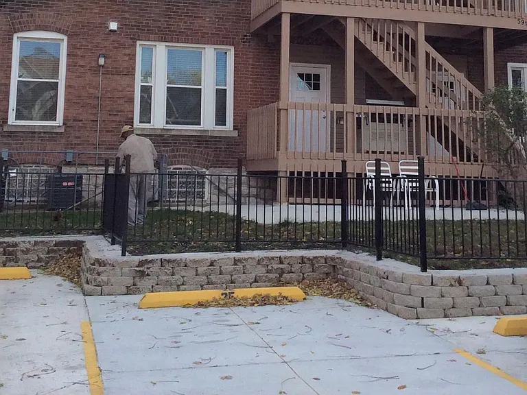 Rear view shows entrance and off-street parking.