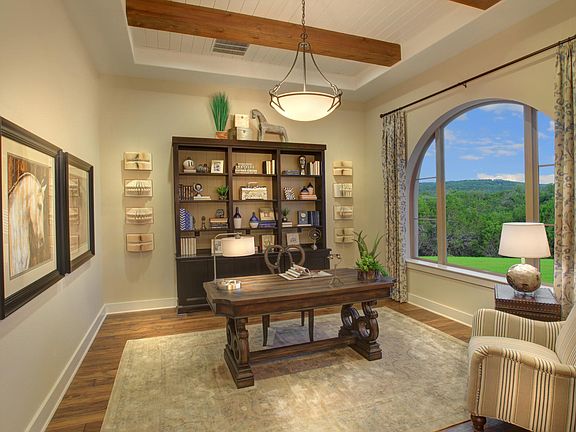 Study featuring a shiplap and beam statement ceiling