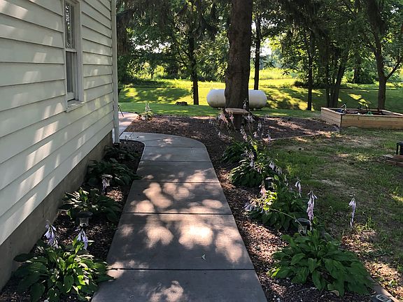 Sidewalk leading to backyard