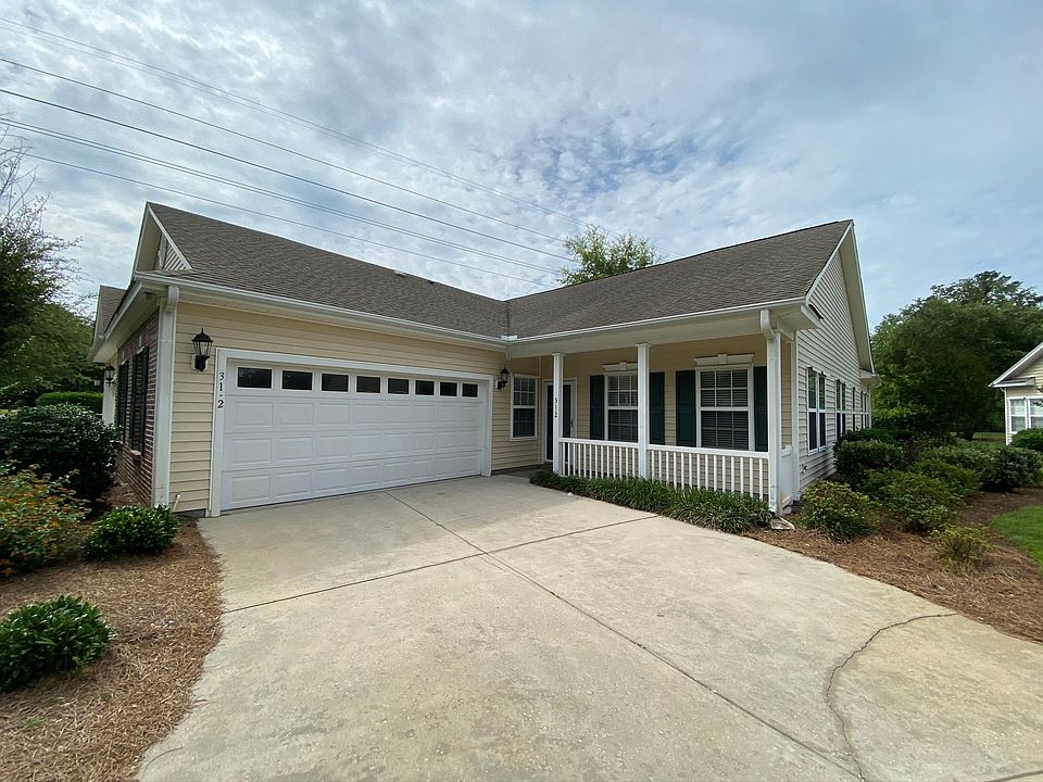 Front of home with front porch and two car garage