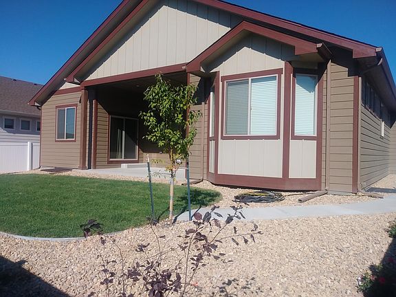 Back yard with covered porch and automatic sprinkler system