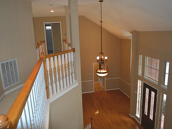 Dramatic 2-Story Entry with Beautiful Bamboo Flooring and designer Paints!