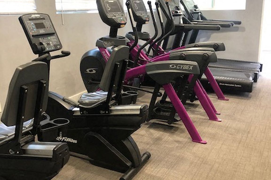 Fitness center featuring CYBEX and Life Fitness equipment