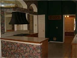 Large kitchen with plenty of storage and work space.