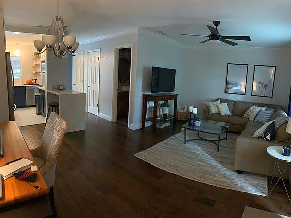 Open concept living, kitchen, and dining room.